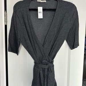 Ann Taylor loft wrap top. Black and white striped. Peplum bottom. NWT